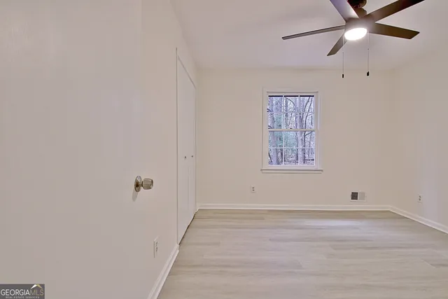 a view of an empty room with a window