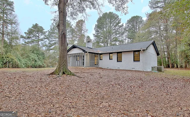 a house with trees in front of it