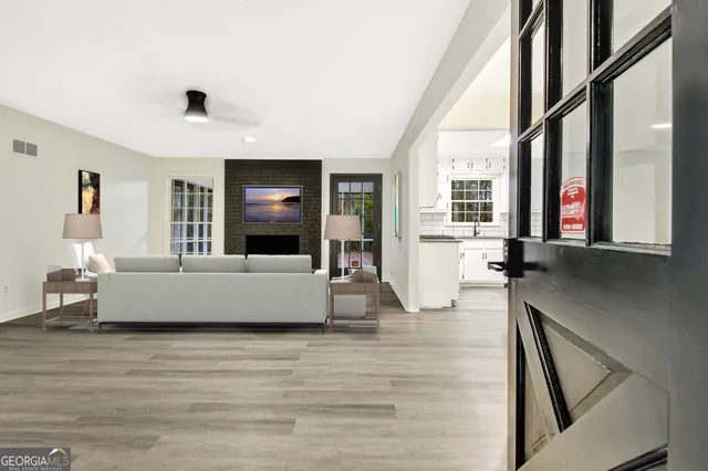 a living room with furniture and a flat screen tv