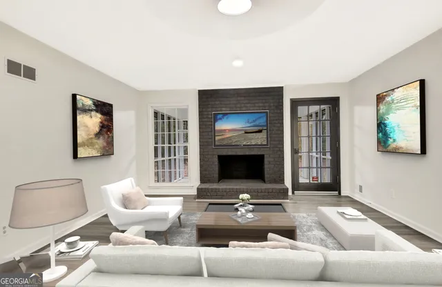 a living room with furniture and a fireplace