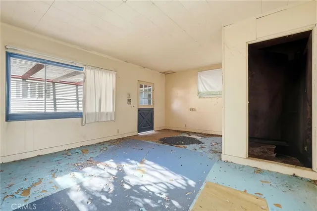 an empty room with windows