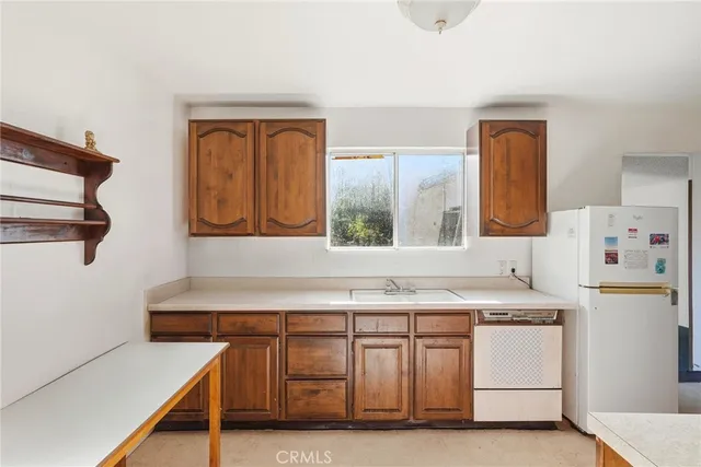 a kitchen with a stove and a sink