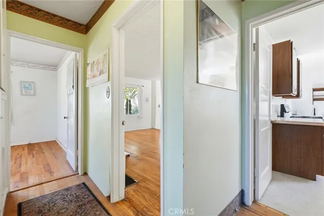 a view of a bathroom from a corridor