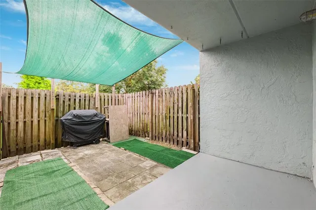 a view of a deck with wooden fence and floor