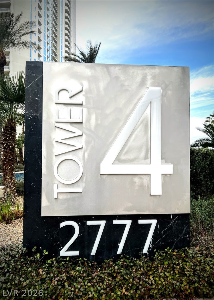 2777 Paradise Road, Unit 1603 Las Vegas, NV 89109 - Photo 1 of 4 A distinguished entrance sign marks this contemporary residence, set amidst lush tropical landscaping.