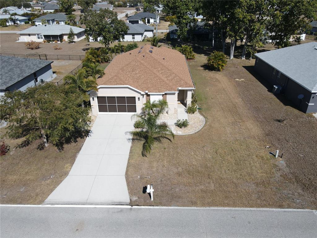 25554 Prada Drive Punta Gorda, FL 33955 - Photo 1 of 56 an aerial view of a house with yard and mountain view in back