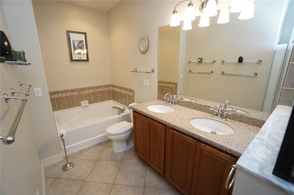 25554 Prada Drive Punta Gorda, FL 33955 - Photo 18 of 56 a bathroom with a sink a toilet and a mirror