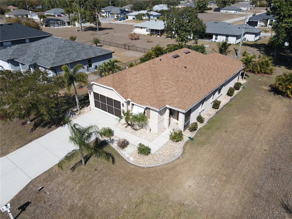 25554 Prada Drive Punta Gorda, FL 33955 - Photo 2 of 56 an aerial view of a house with backyard space and lake view