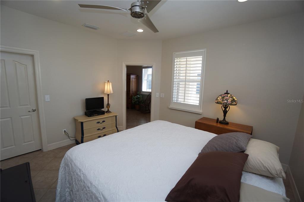 25554 Prada Drive Punta Gorda, FL 33955 - Photo 21 of 56 a bedroom with a bed and a television