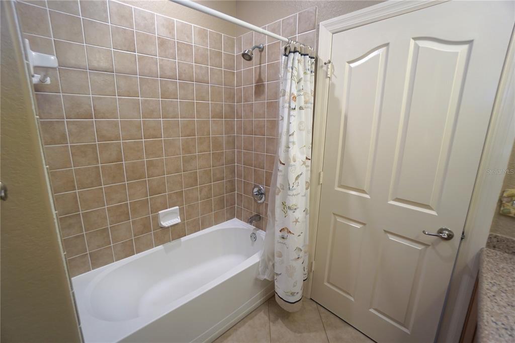 25554 Prada Drive Punta Gorda, FL 33955 - Photo 23 of 56 a bathroom with a bathtub and a shower