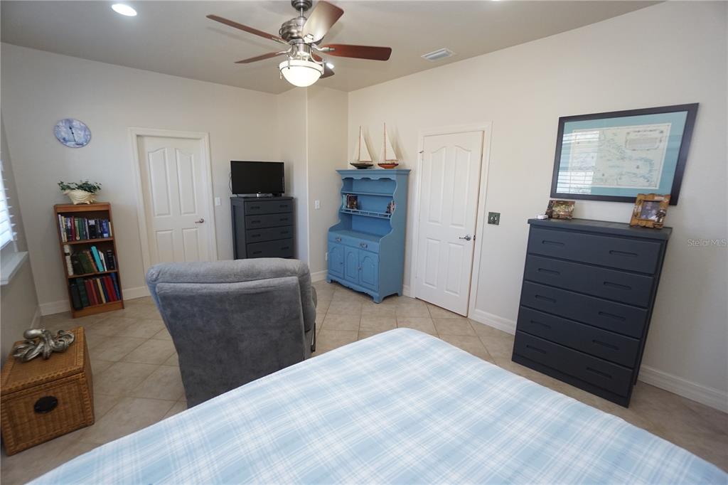25554 Prada Drive Punta Gorda, FL 33955 - Photo 25 of 56 a bedroom with a bed and a television