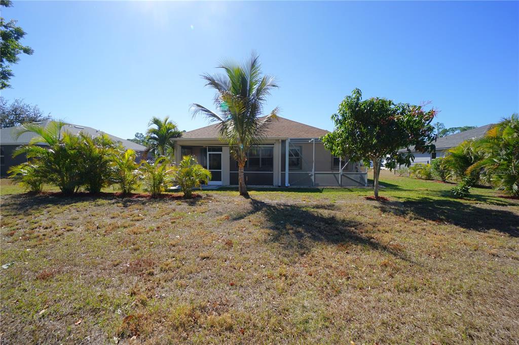 25554 Prada Drive Punta Gorda, FL 33955 - Photo 36 of 56 a view of a house with a yard and tree s