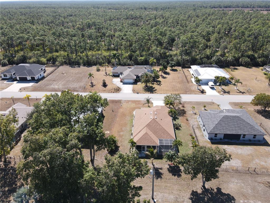 25554 Prada Drive Punta Gorda, FL 33955 - Photo 38 of 56 an aerial view of house with yard and mountain view in back