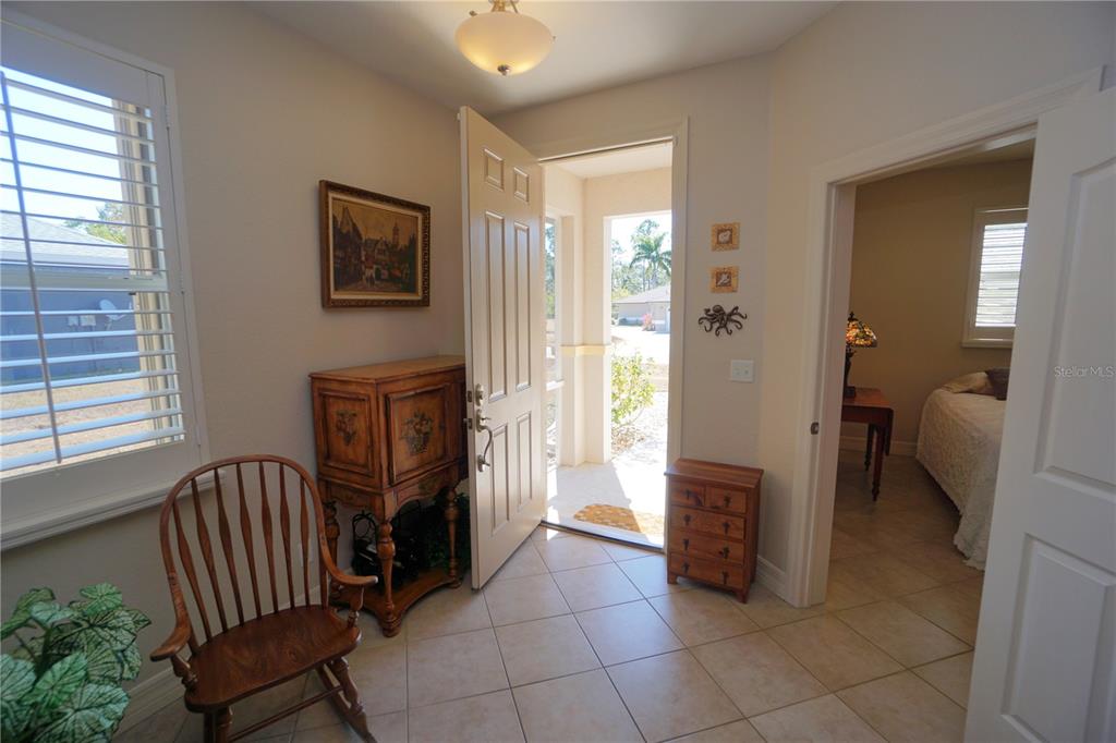 25554 Prada Drive Punta Gorda, FL 33955 - Photo 5 of 56 a view of a hallway with furniture and a livingroom