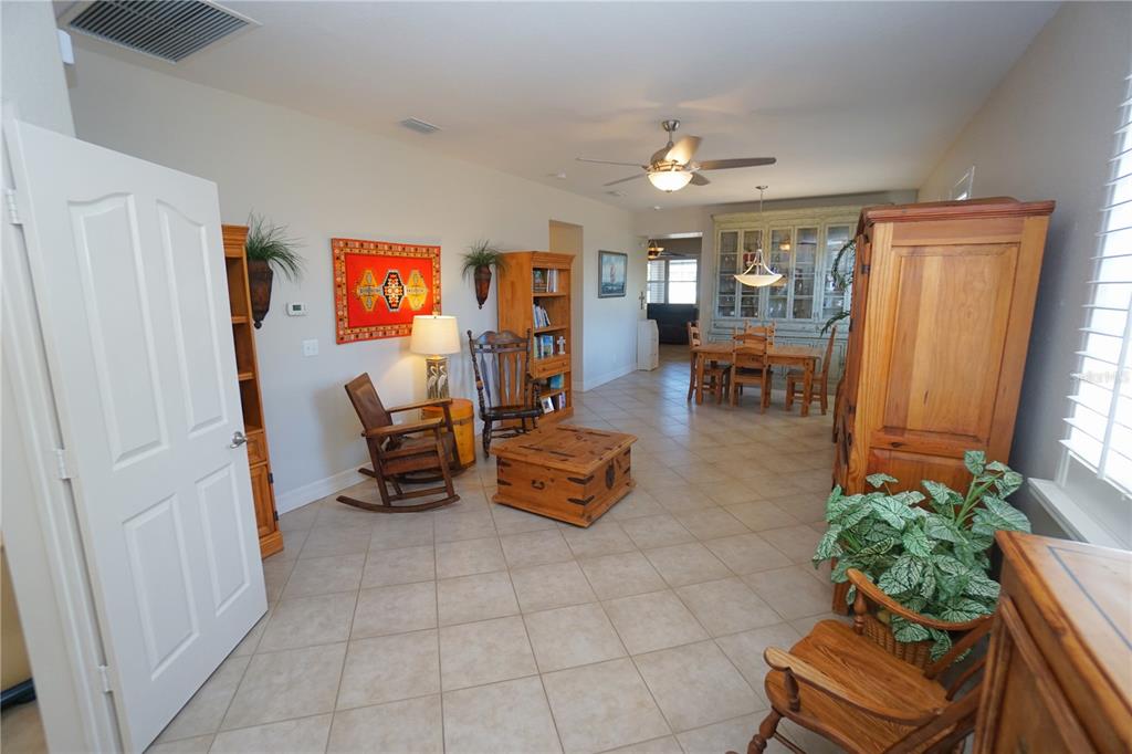 25554 Prada Drive Punta Gorda, FL 33955 - Photo 7 of 56 a living room with furniture and a chandelier
