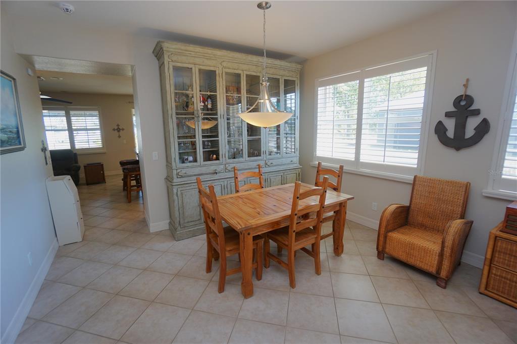 25554 Prada Drive Punta Gorda, FL 33955 - Photo 10 of 56 a dining room with furniture and window