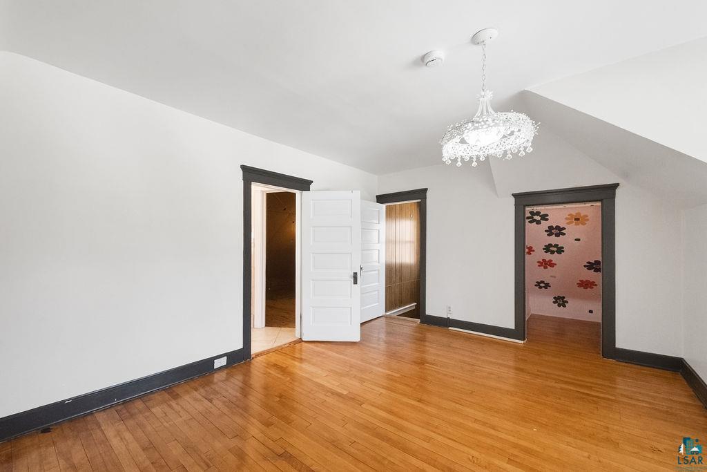 4220 McCulloch Street Duluth, MN 55804 - Photo 17 of 27 Unfurnished bedroom with light wood-type flooring and suspended lighting