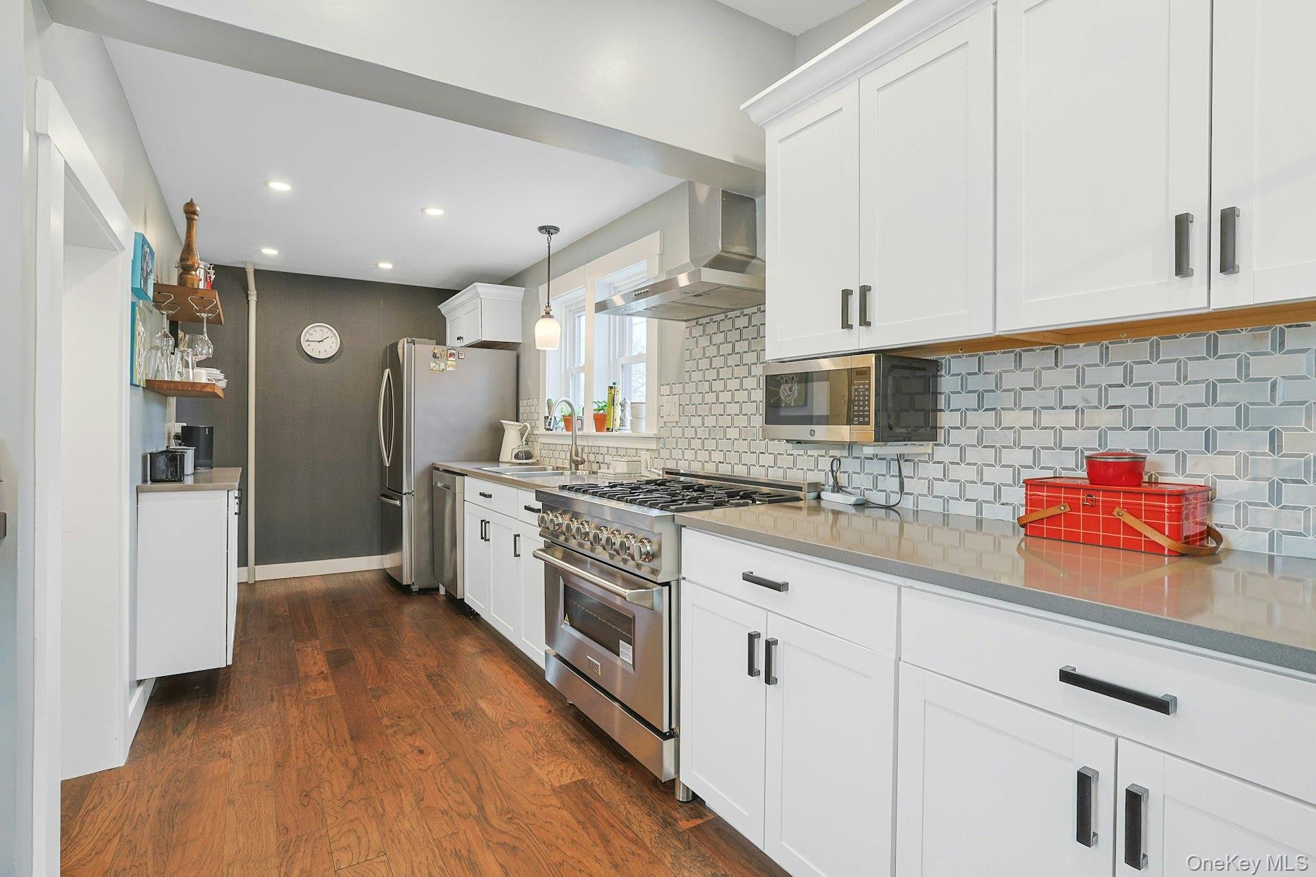 56 North Greenbush Road West Nyack, NY 10994 - Photo 23 of 37 a kitchen with stainless steel appliances granite countertop a sink a stove a refrigerator and cabinets