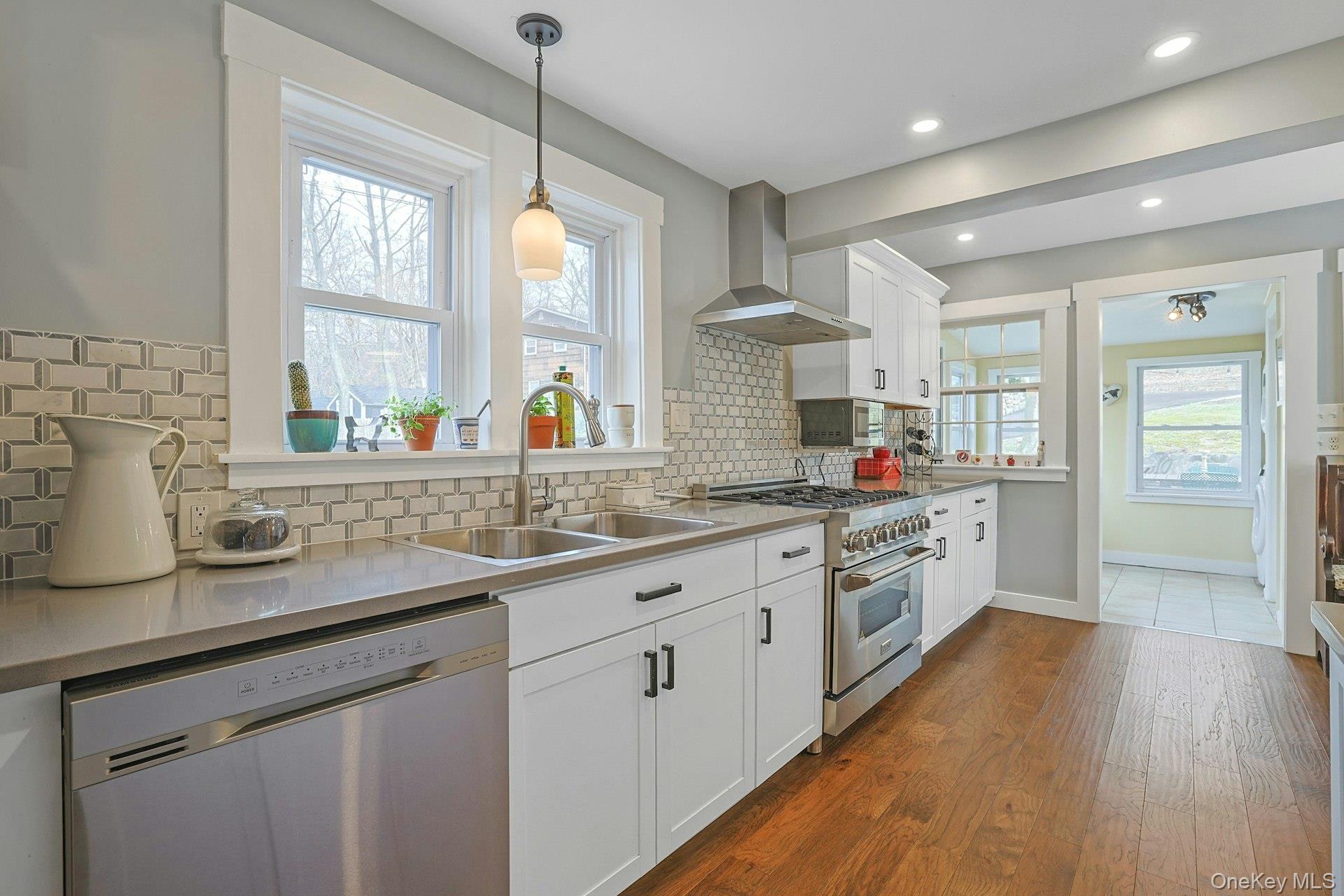 56 North Greenbush Road West Nyack, NY 10994 - Photo 25 of 37 a kitchen with stainless steel appliances granite countertop a sink a stove and wooden floor