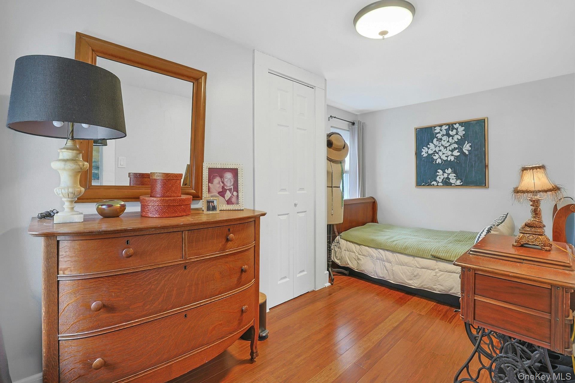 56 North Greenbush Road West Nyack, NY 10994 - Photo 36 of 37 a bedroom with a bed and a lamp on dresser