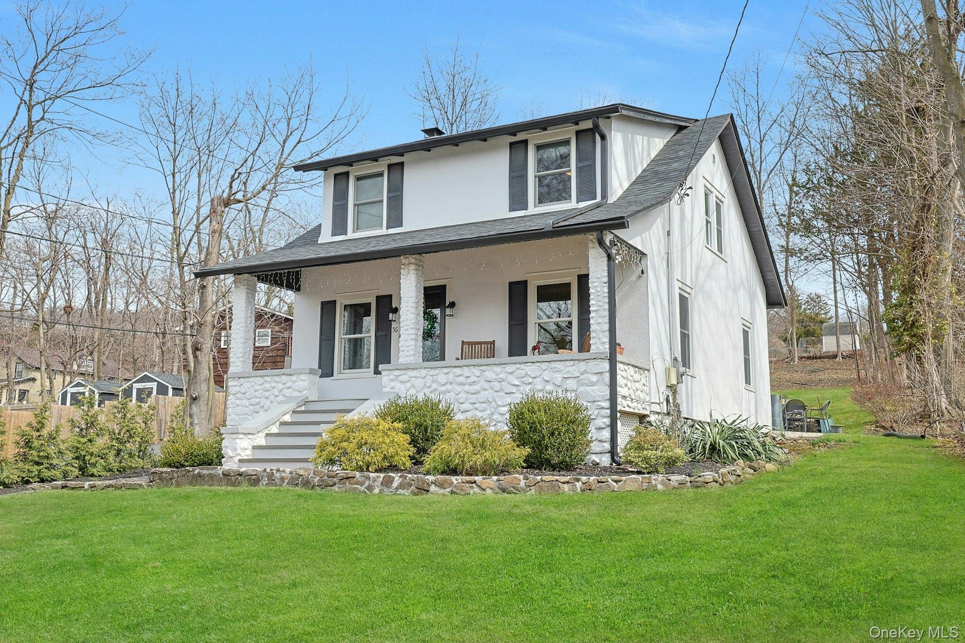 56 North Greenbush Road West Nyack, NY 10994 - Photo 5 of 37 a front view of a house with a garden