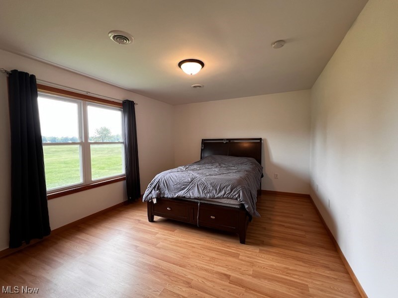 6949 Fee Road Rome, OH 44085 - Photo 10 of 19 Bedroom featuring light wood-type flooring