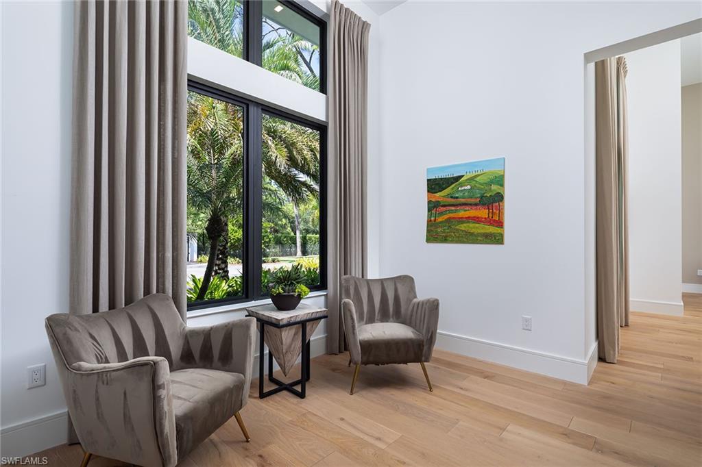 494 Gordonia Road Naples, FL 34108 - Photo 15 of 42 a living room with furniture and a potted plant