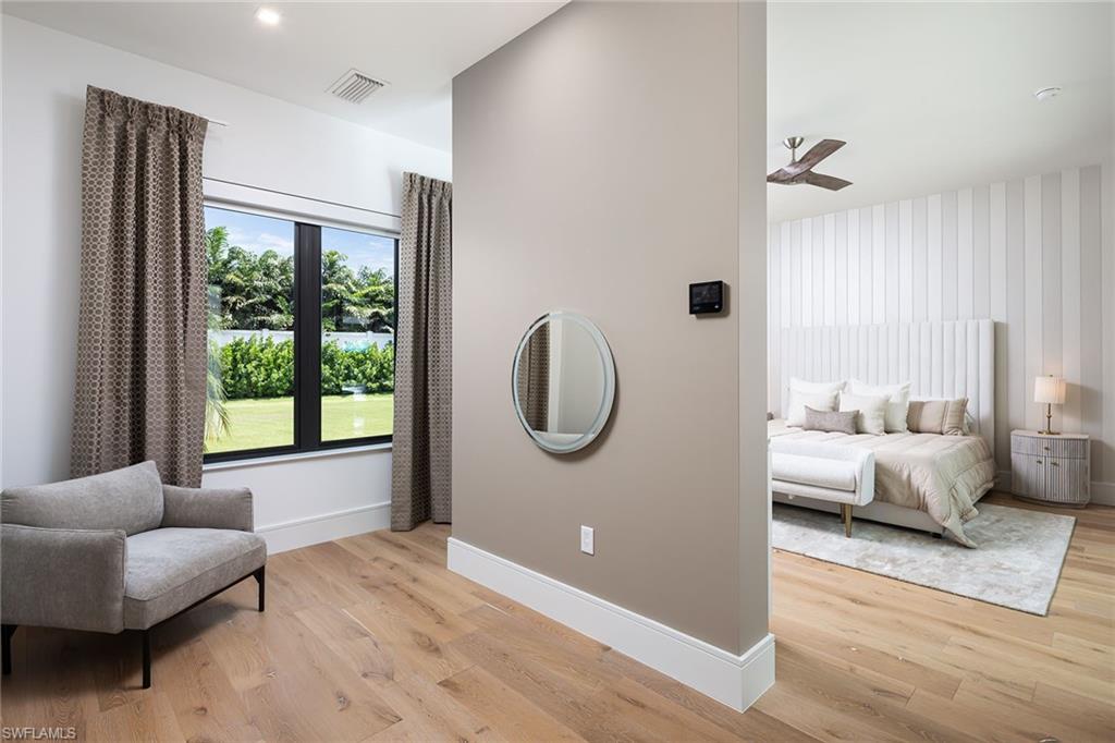494 Gordonia Road Naples, FL 34108 - Photo 24 of 42 a bedroom with furniture and a large window