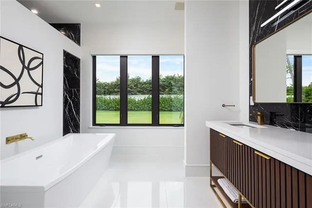 a bathroom with a bathtub and a sink