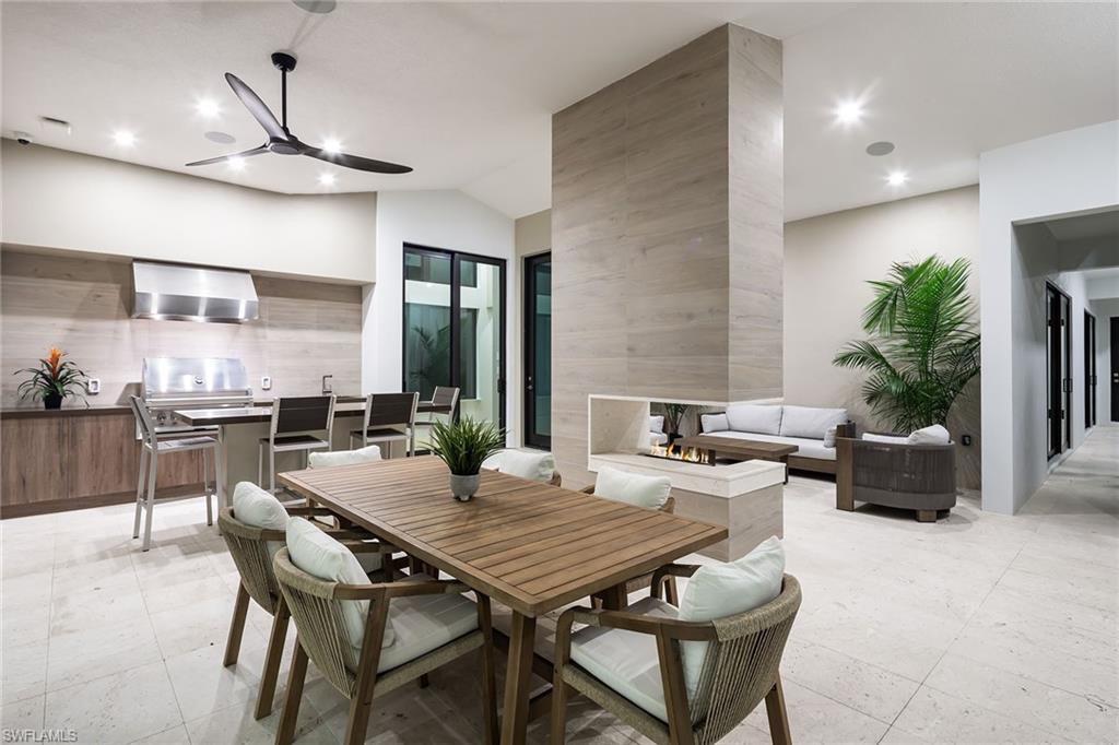 494 Gordonia Road Naples, FL 34108 - Photo 31 of 42 a view of a dining room with furniture