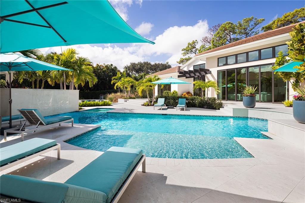 494 Gordonia Road Naples, FL 34108 - Photo 35 of 42 a view of a house with garden and sitting area
