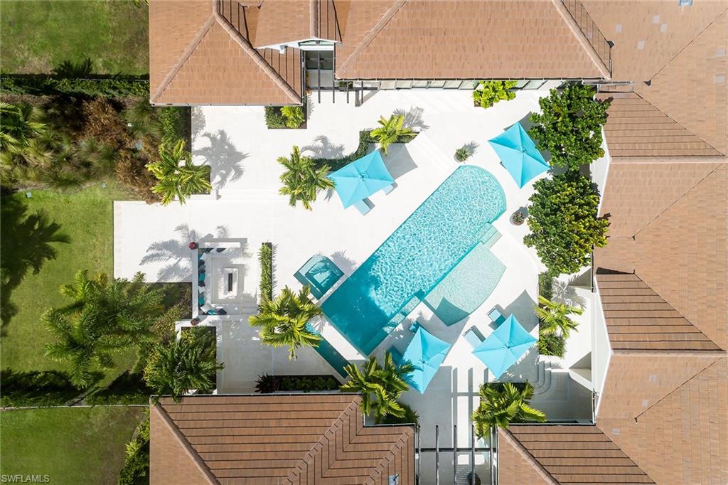 494 Gordonia Road Naples, FL 34108 - Photo 40 of 42 an aerial view of a house with a yard and a fountain