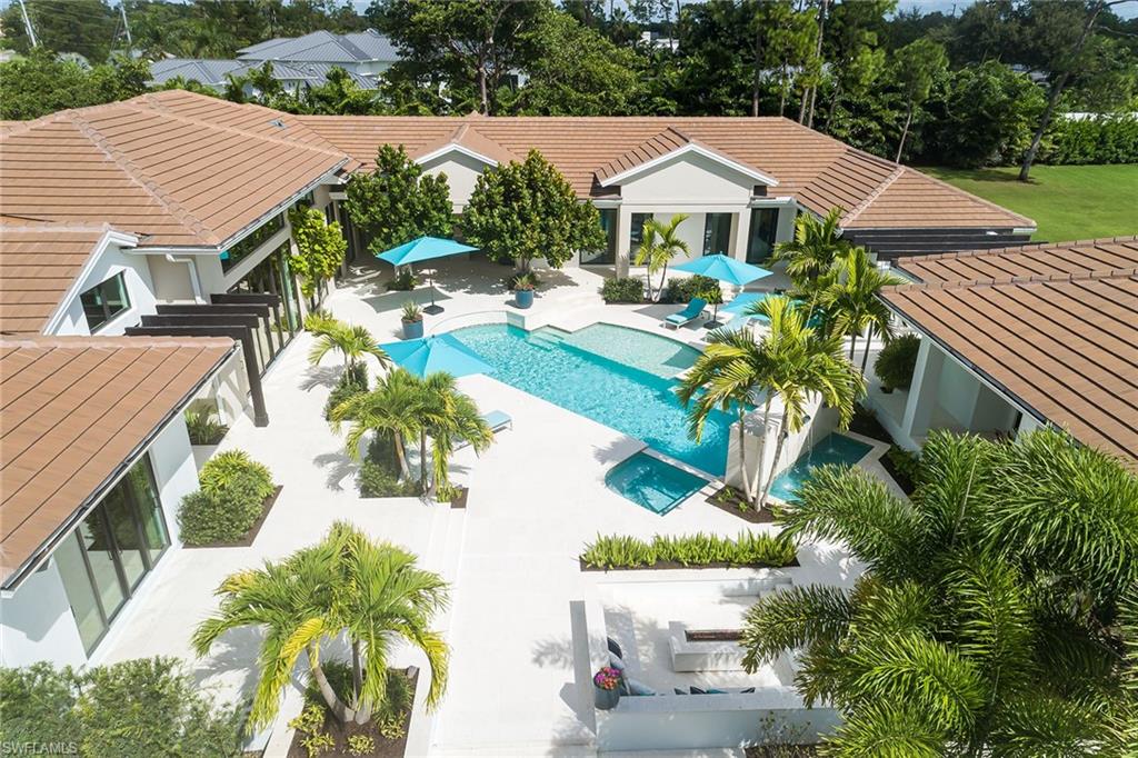 494 Gordonia Road Naples, FL 34108 - Photo 41 of 42 aerial view of a house with yard and sitting area