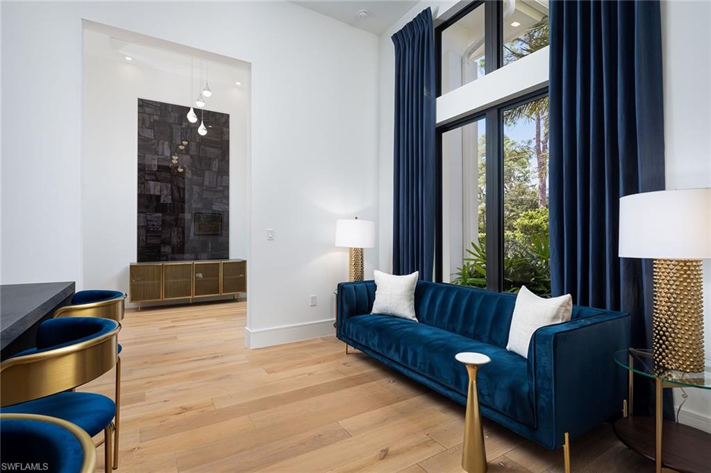 494 Gordonia Road Naples, FL 34108 - Photo 10 of 42 a living room with furniture and a window