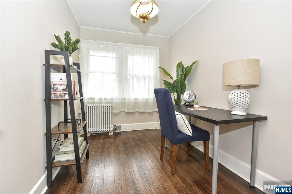 228 Ridgefield Avenue Bogota, NJ 07603 - Photo 16 of 29 a view of a workspace with furniture and a potted plant