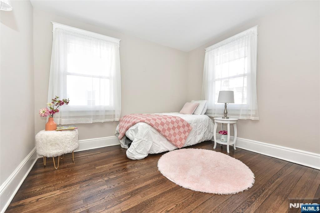 228 Ridgefield Avenue Bogota, NJ 07603 - Photo 18 of 29 a bedroom with wooden floor and windows