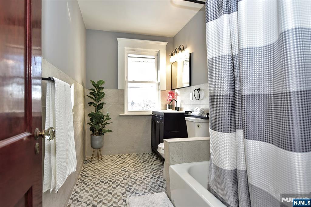 228 Ridgefield Avenue Bogota, NJ 07603 - Photo 20 of 29 a bathroom with a sink toilet and shower