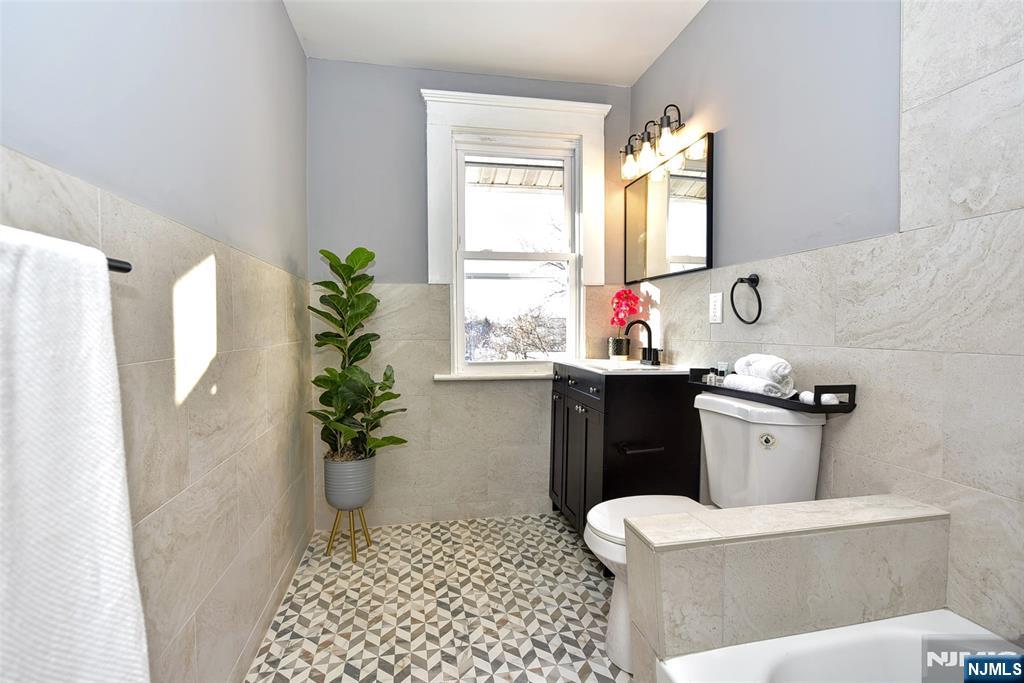 228 Ridgefield Avenue Bogota, NJ 07603 - Photo 22 of 29 a bathroom with a sink toilet and shower