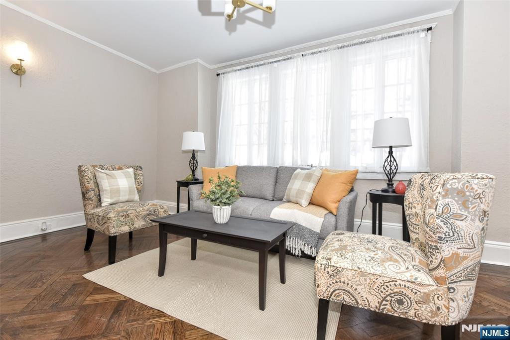 228 Ridgefield Avenue Bogota, NJ 07603 - Photo 5 of 29 a living room with furniture and a lamp