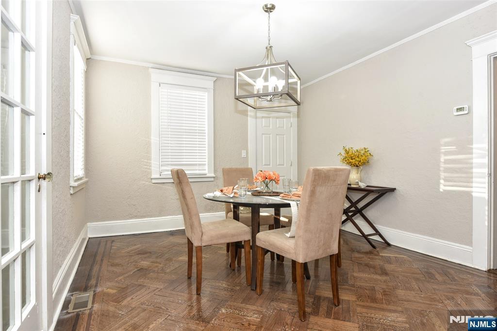 228 Ridgefield Avenue Bogota, NJ 07603 - Photo 7 of 29 a view of a dining room with furniture window and wooden floor