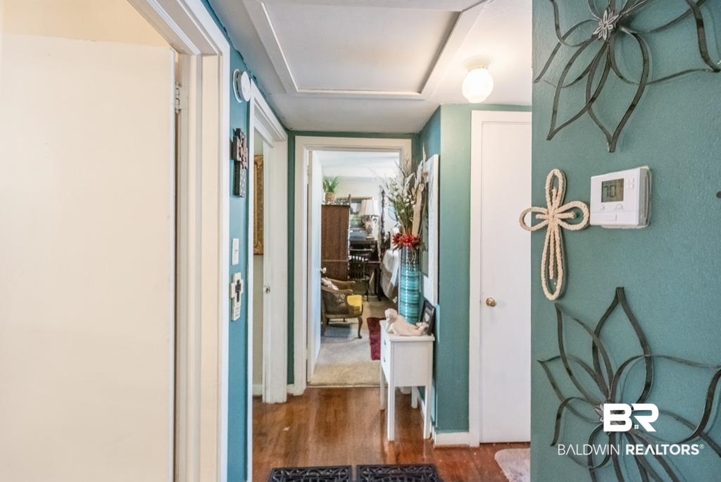 109 Esplanade Avenue Mobile, AL 36606 - Photo 20 of 45 Hallway with dark wood finished floors and baseboards