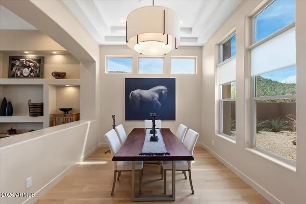a view of a dining room with furniture window and wooden floor