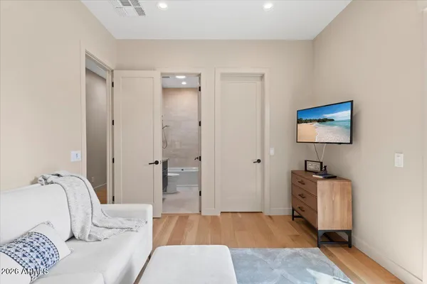 a bedroom with a bed and a couch