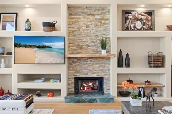 a living room with furniture and a fireplace