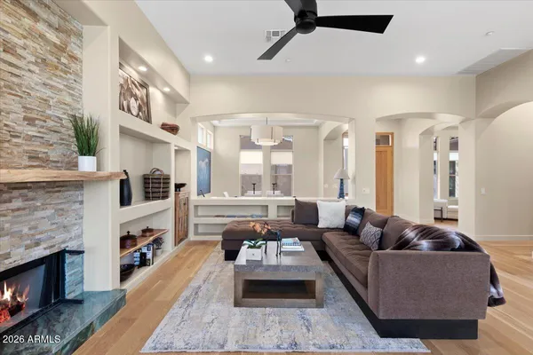a living room with furniture and a fireplace