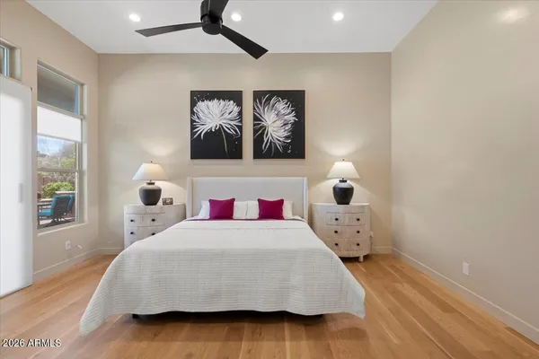 a bedroom with a bed and lamp