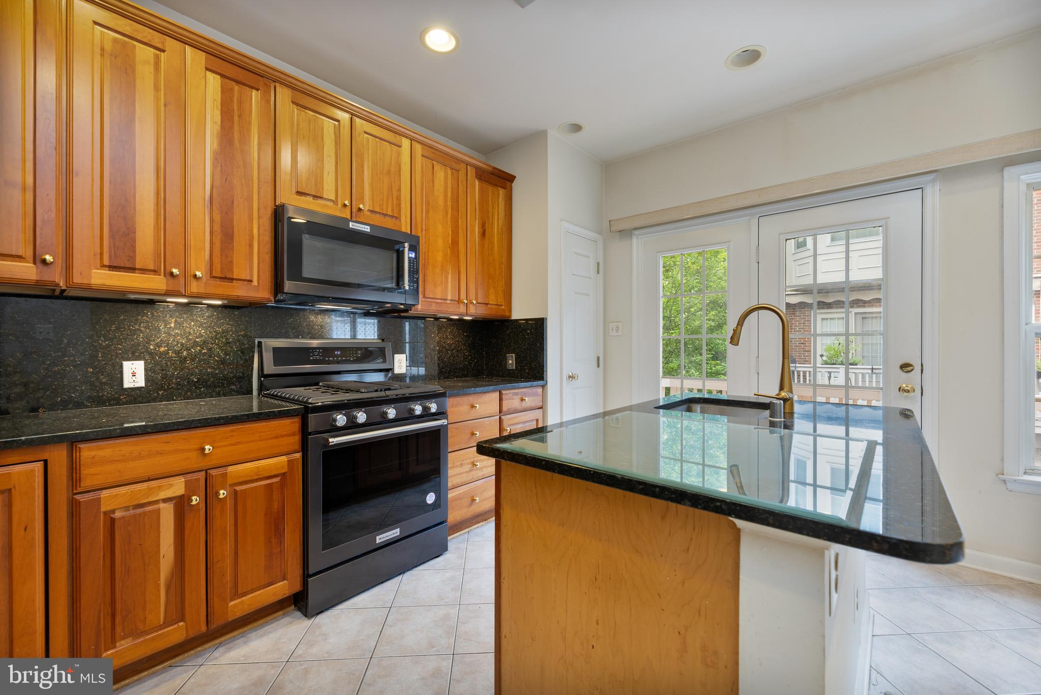 800 Capitol Square Place Southwest Washington, DC 20024 - Photo 12 of 52 a kitchen with kitchen island granite countertop a sink appliances cabinets and a counter top space