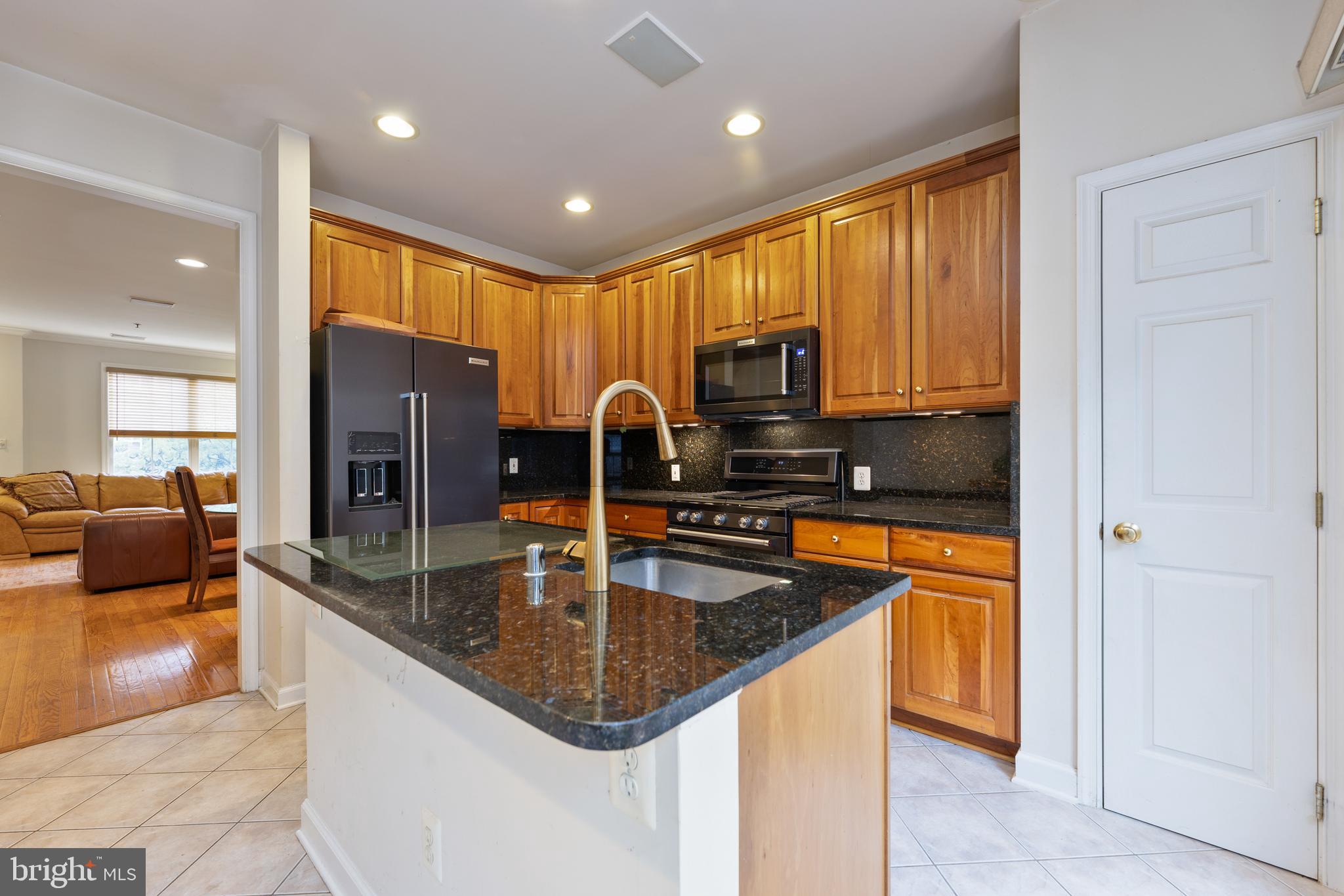 800 Capitol Square Place Southwest Washington, DC 20024 - Photo 14 of 52 a kitchen with stainless steel appliances granite countertop a sink a stove and a refrigerator