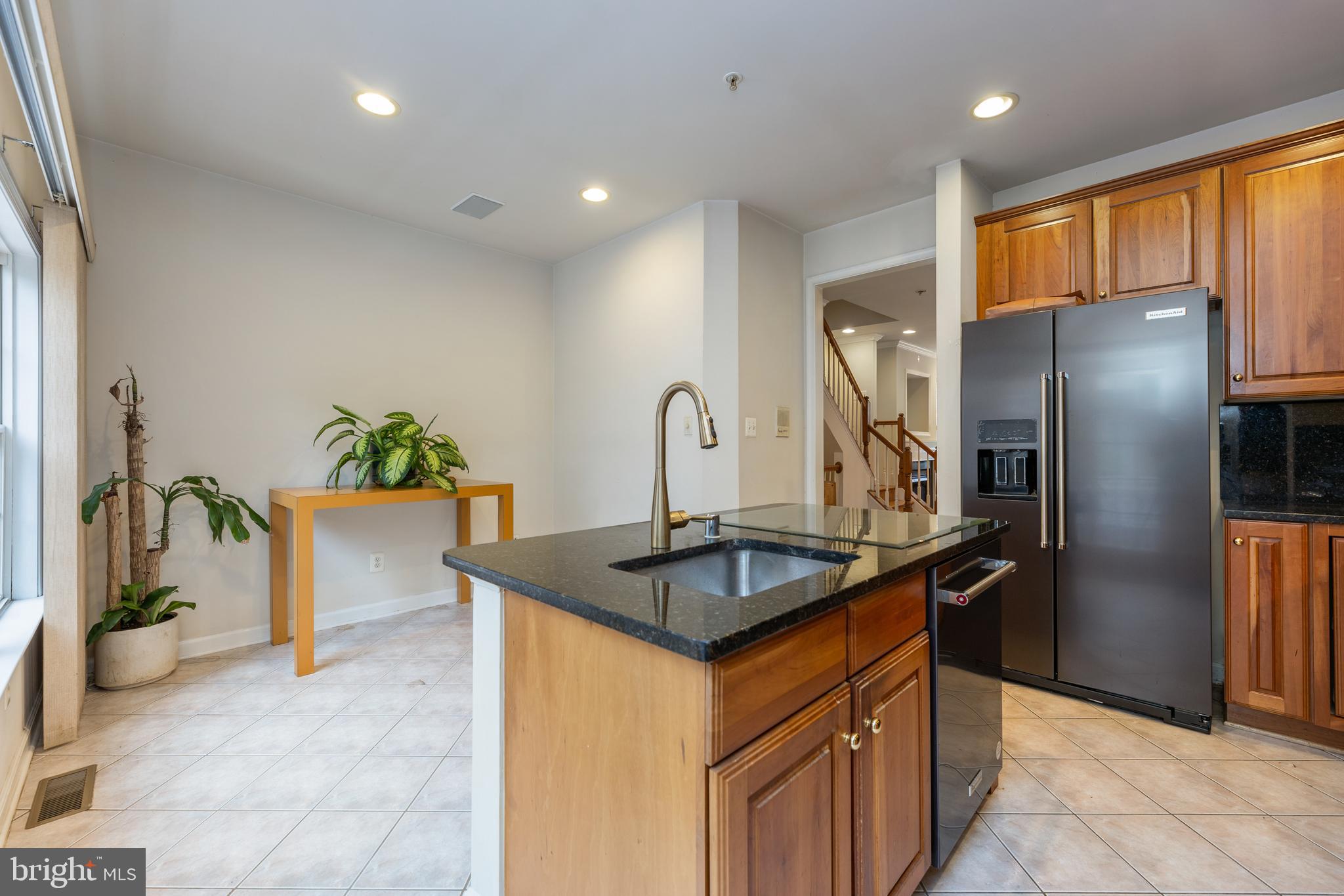 800 Capitol Square Place Southwest Washington, DC 20024 - Photo 15 of 52 a kitchen with stainless steel appliances granite countertop a sink a refrigerator and a granite counter tops