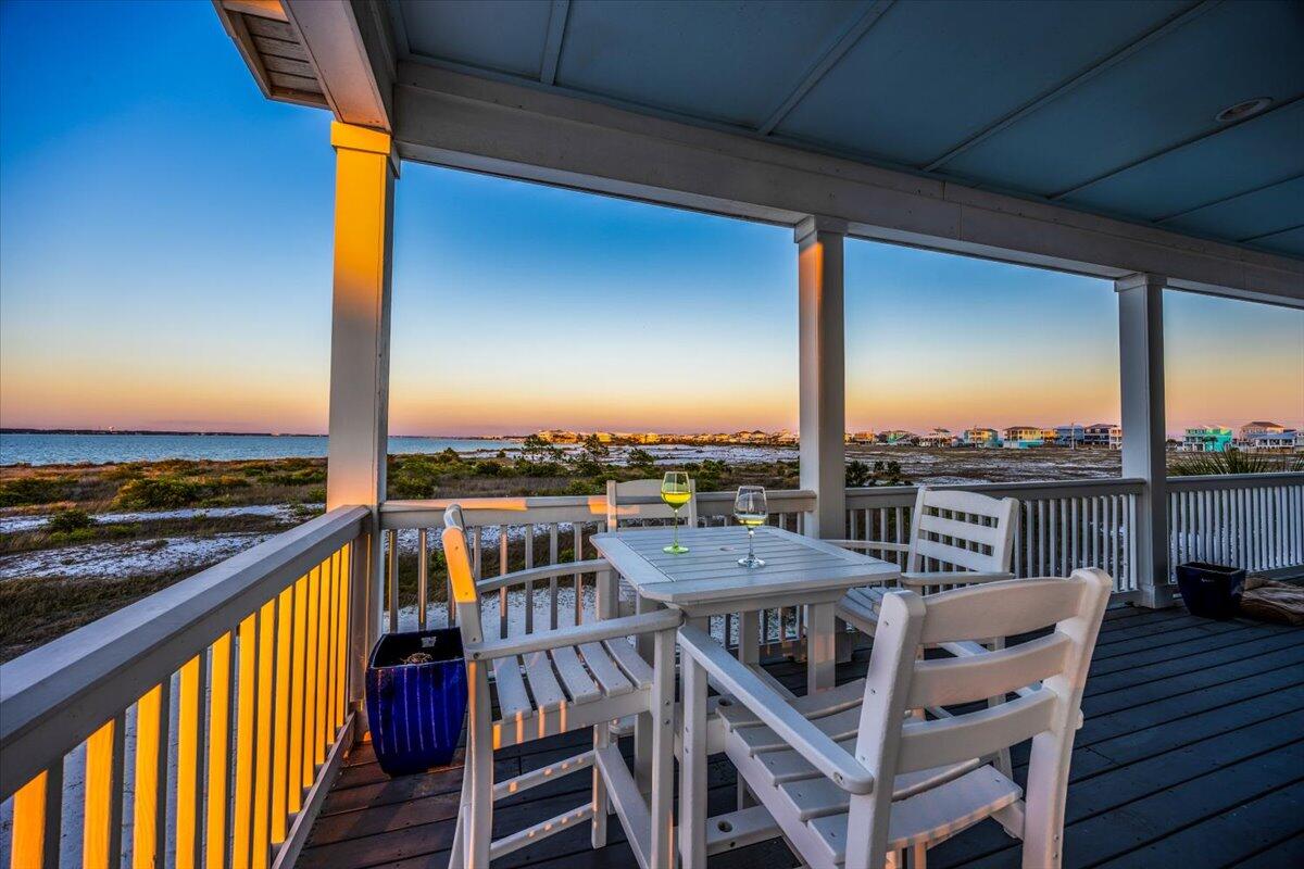 1454 Seaside Circle Navarre, FL 32566 - Photo 12 of 18 a view of a balcony with wooden floor and city view